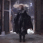 Блондин в черном плаще на фоне открытого дверного проема, ночь; аватарка 88×88px