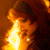 Профиль девушки на фоне пламени; аватарка 100×100px