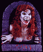 Рыжеволосая грудастая и клыкастая вампирша; фэнтези аватарка анимированная 150×150px